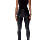 vegan leather legging with a medium rise and flattering fit in black