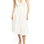 Tiered midi dress with a deep v-neck, adjustable spaghetti straps, ruffled under bodice and smocked back in ivory