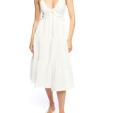 Tiered midi dress with a deep v-neck, adjustable spaghetti straps, ruffled under bodice and smocked back in ivory