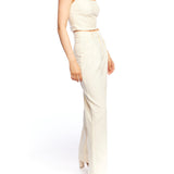 Mid-rise, wide leg pants with pleated front, side pockets, faux back pockets and belt loops in ivory