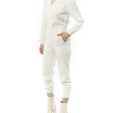 jumpsuit featuring a collared, button-front, long, cuffed sleeves, elasticized waist and bottom cuffs in ivory