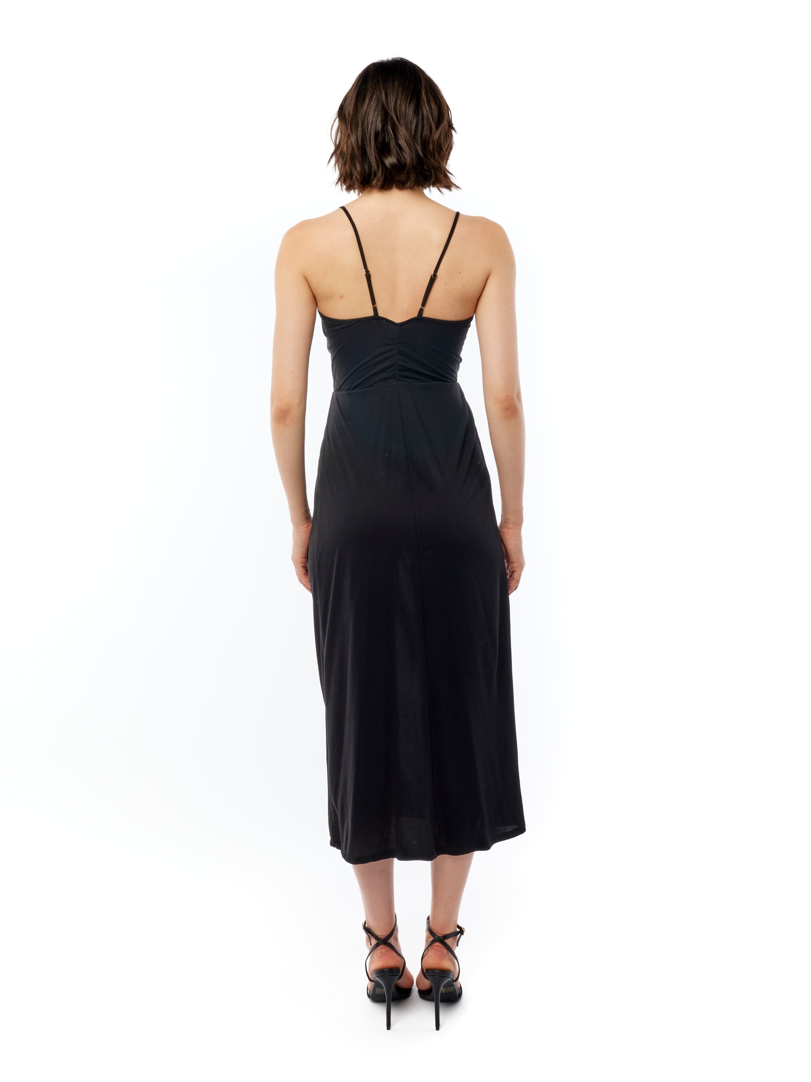 midi dress with a surplice top, gathered twist front, adjustable spaghetti straps and side slit in black