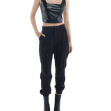 pleated pant with a tapered leg, elasticized cuffs, zip and button closure and side pockets in black