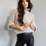 ribbed, chunky knit turtleneck sweater featuring slight balloon sleeves and a funnel neck in grey