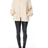 Cozy zip up, hooded jacket with faux shearling, side pockets and snap detailing in ivory and creme