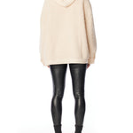 Cozy zip up, hooded jacket with faux shearling, side pockets and snap detailing in ivory and creme