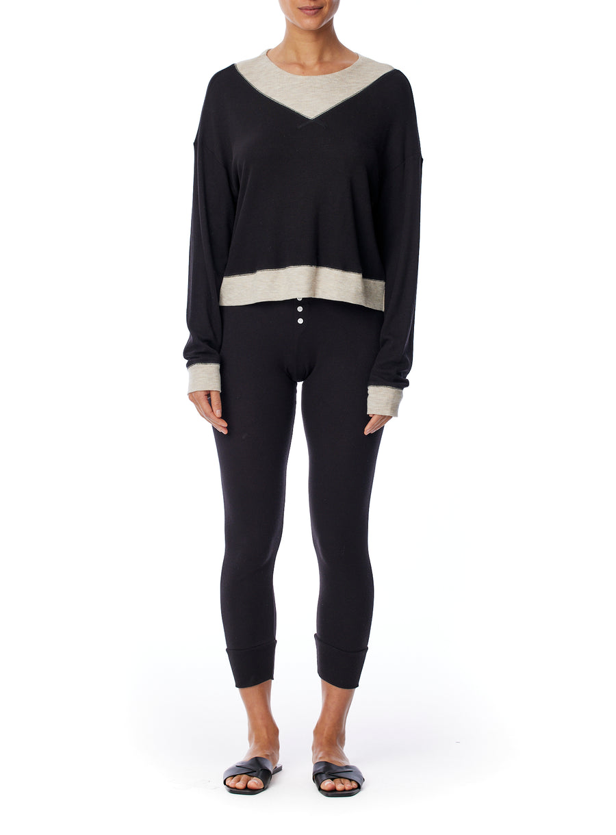 Long sleeve thermal top with a relaxed fit, ballet neck with contrasting hem, cuffs and bib in black