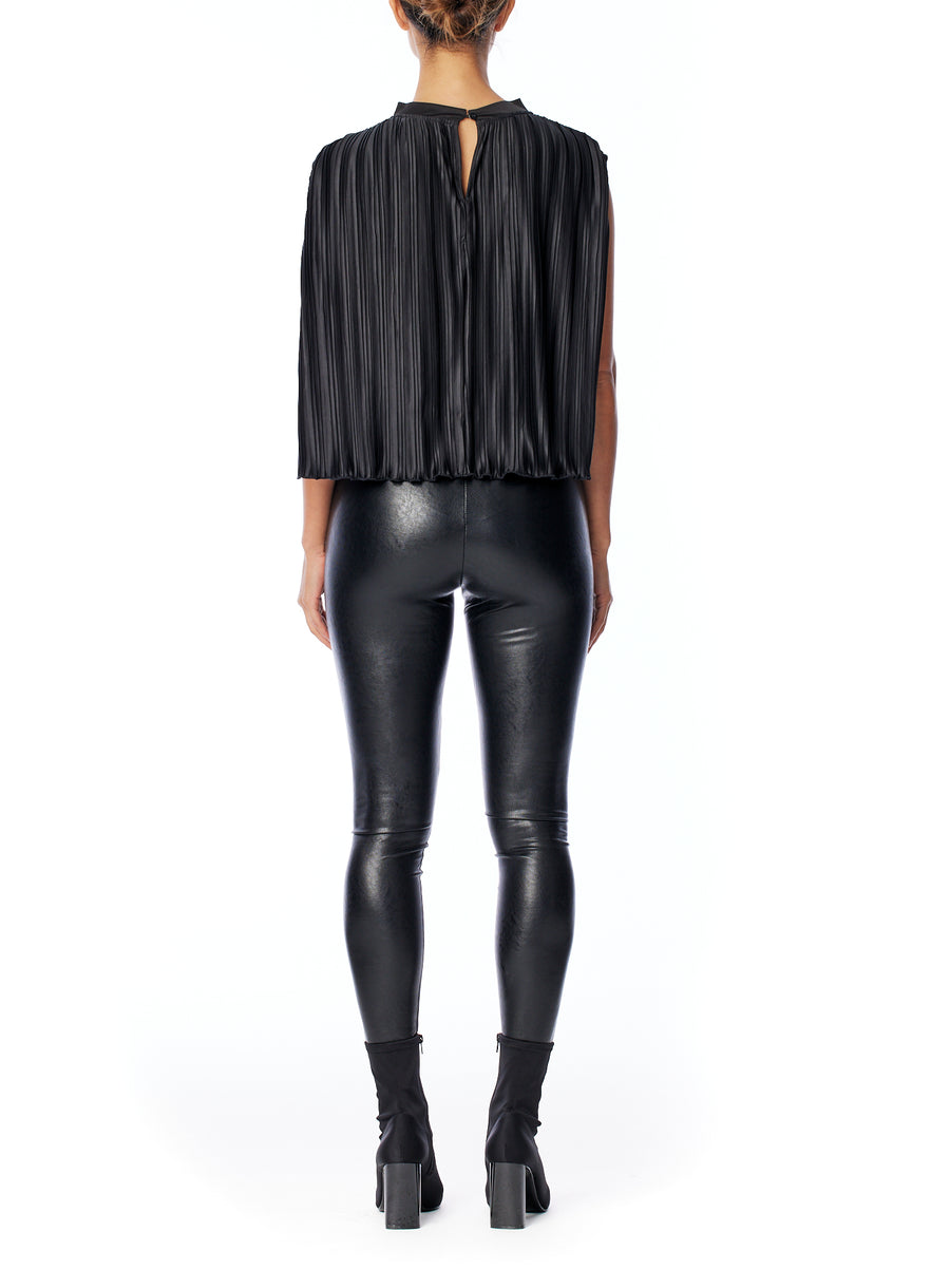 chic sleeveless, pleated cape top with a slight mock neck in black