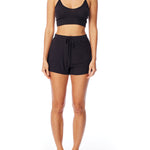 Medium rise, comfy ribbed lounge shorts with elasticized drawstring waist and relaxed fit in black