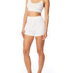 Medium rise, comfy ribbed lounge shorts with elasticized drawstring waist and relaxed fit in ivory