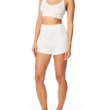 Medium rise, comfy ribbed lounge shorts with elasticized drawstring waist and relaxed fit in ivory
