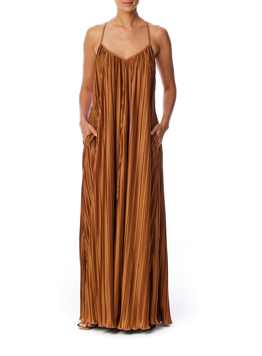 pleated maxi dress with spaghetti straps, v-neck, trapeze cut and criss cross open back in rust