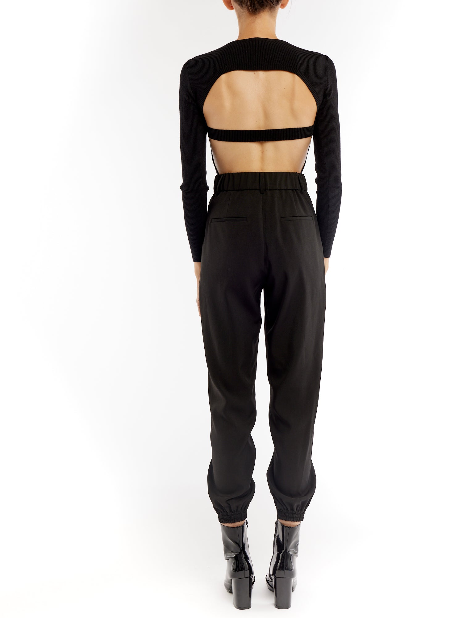 ribbed long sleeve bodysuit with a crew neck and flattering open back with a single strap mid back