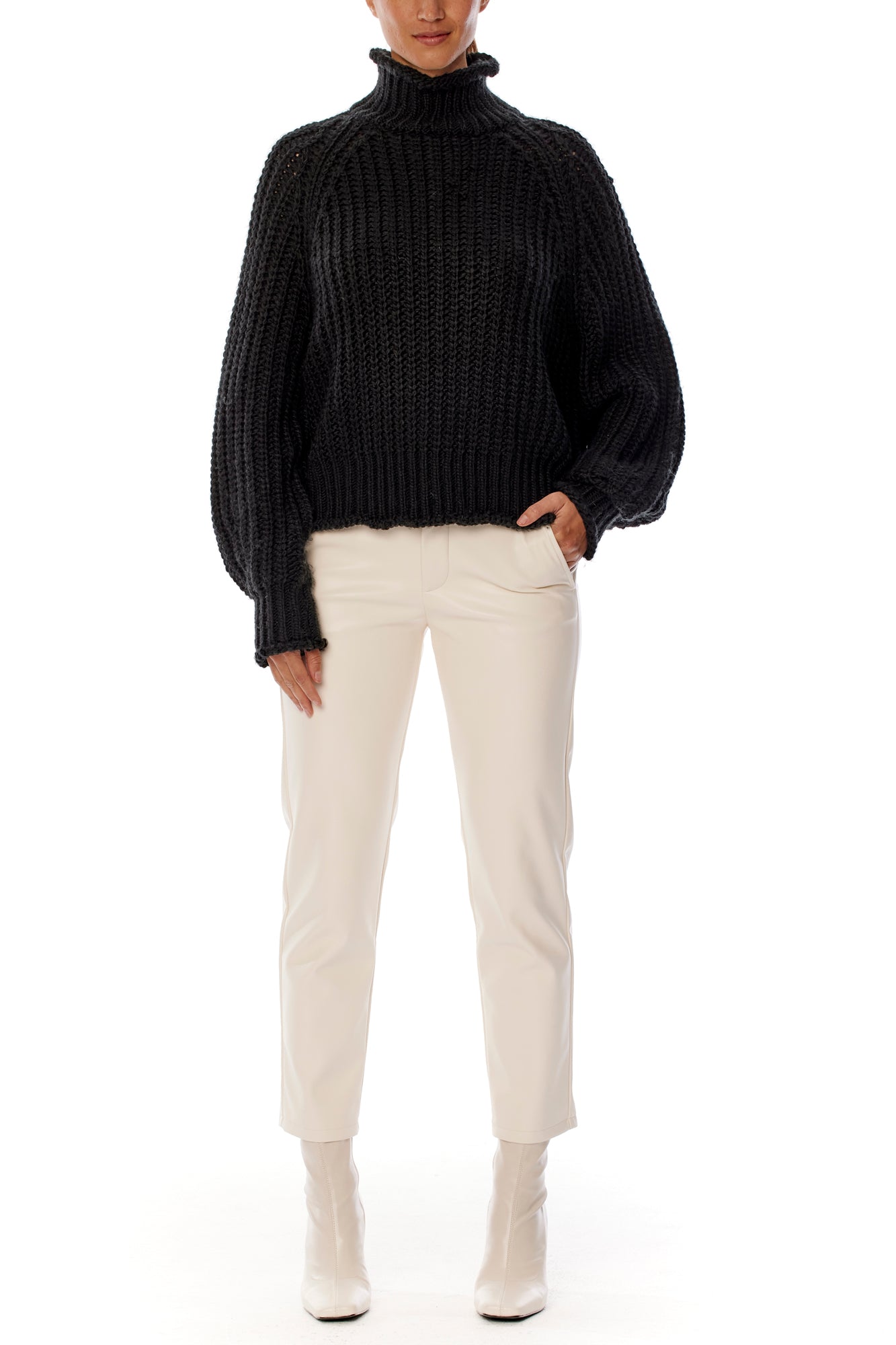 ribbed, chunky knit turtleneck sweater featuring slight balloon sleeves and a funnel neck in black
