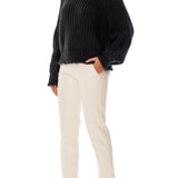 ribbed, chunky knit turtleneck sweater featuring slight balloon sleeves and a funnel neck in black