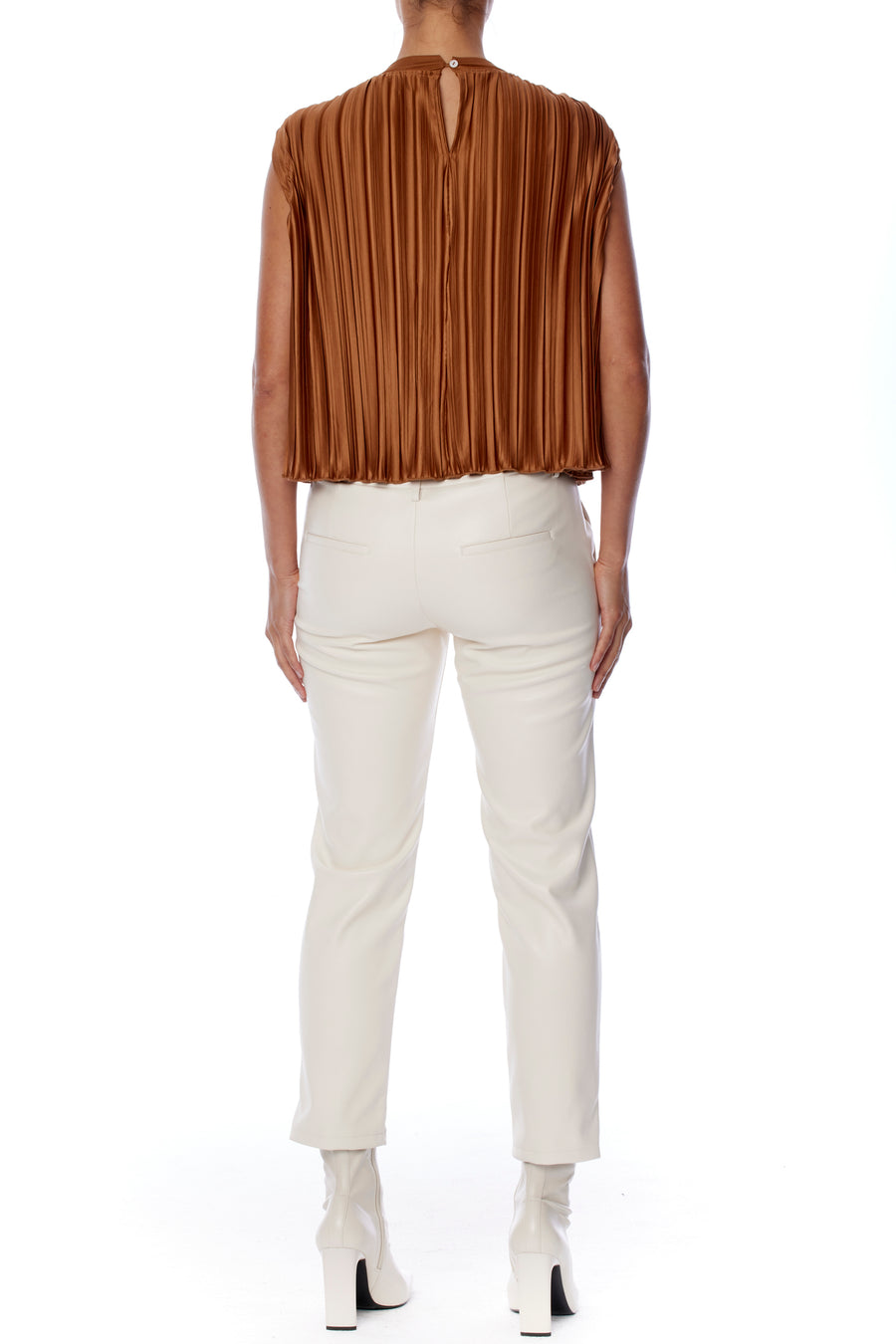 chic sleeveless, pleated cape top with a slight mock neck in rust
