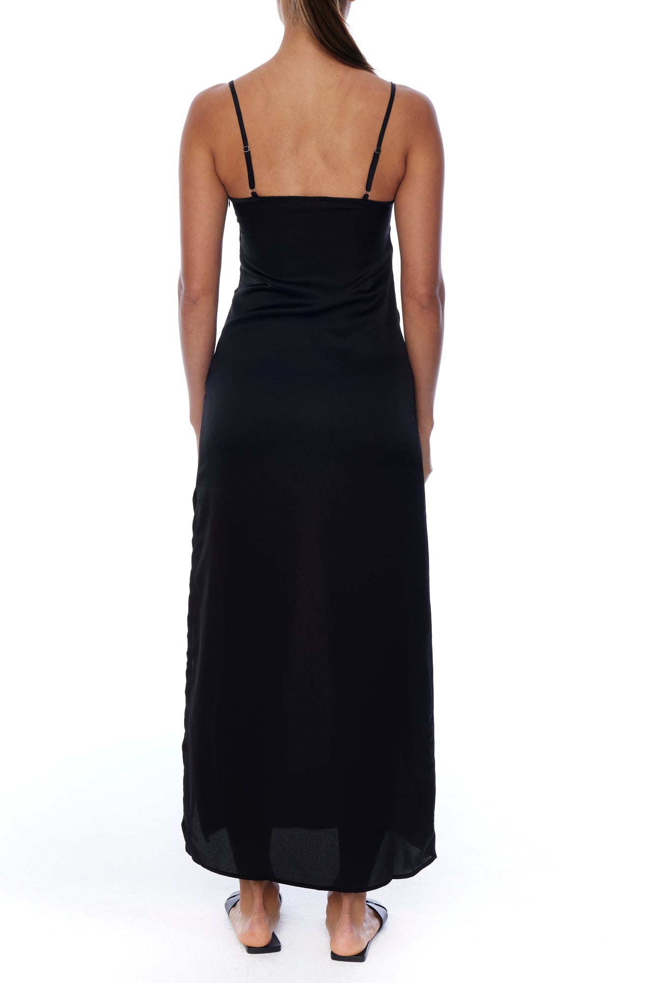 Floor length, v-neck dress with adjustable spaghetti straps and side slit in black