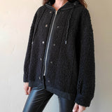 Zip up, hooded vegan jacket with faux shearling, zipper and button closure & side pockets in black