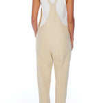 relaxed overalls with knotted front shoulder straps, racer back shoulder straps and pockets in creme