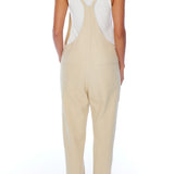 relaxed overalls with knotted front shoulder straps, racer back shoulder straps and pockets in creme